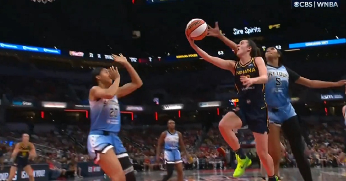 Iowa Fever star Caitlin Clark goes for the basket before a vicious foul Sunday by the Chicago Sky's Angel Reese.