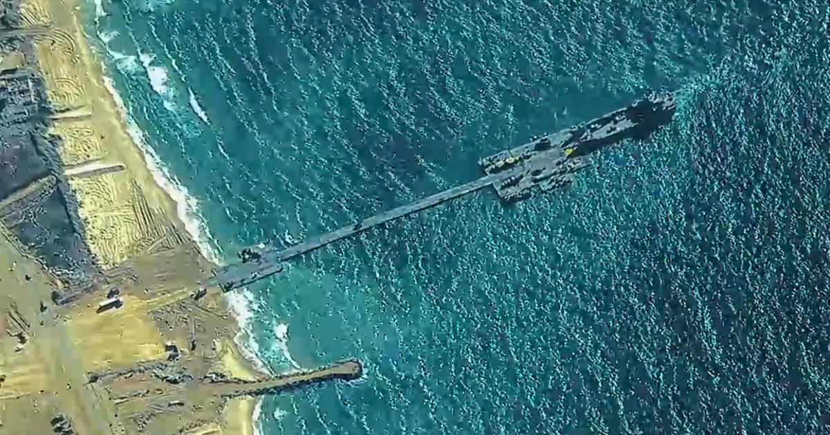 U.S. Army Soldiers assigned to the 7th Transportation Brigade (Expeditionary), U.S. Navy Sailors assigned to Amphibious Construction Battalion 1, and Israel Defense Forces emplace the Trident Pier, May 16, 2024 on the Gaza coast.