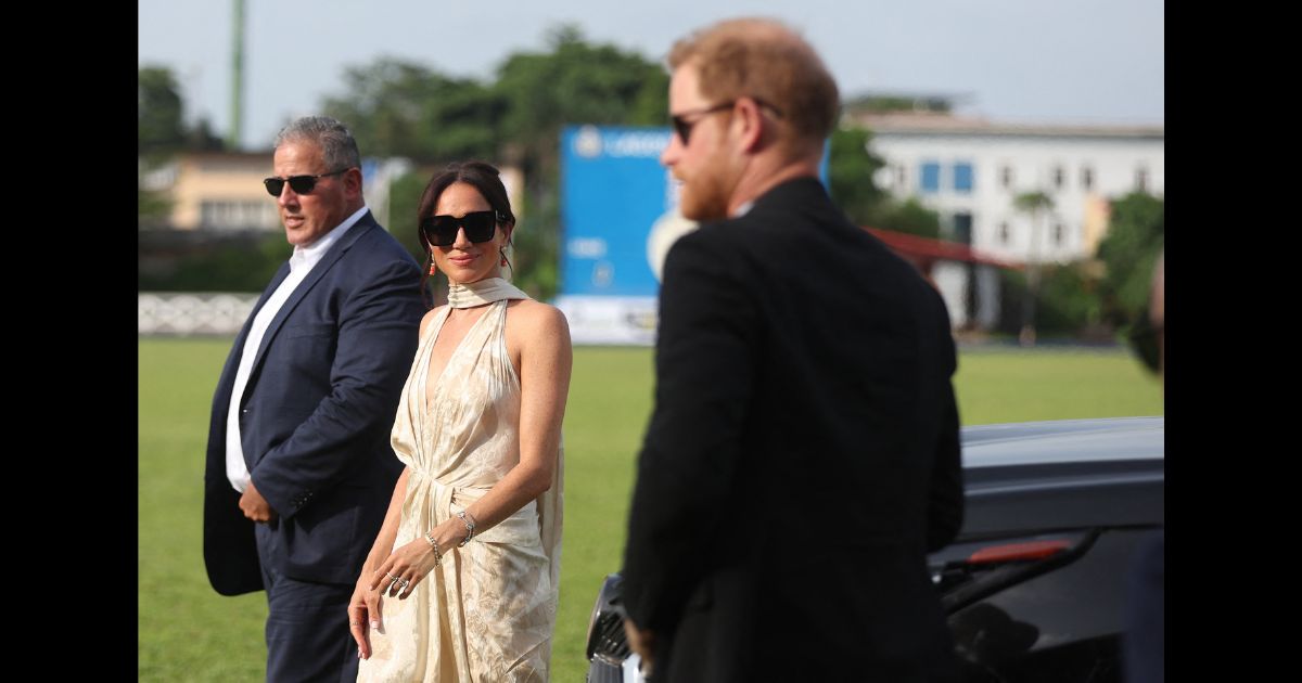 Britain's Meghan (C), Duchess of Sussex, and Britain's Prince Harry (R), Duke of Sussex, arrive at a charity polo game at the Ikoyi Polo Club in Lagos on May 12, 2024 as they visit Nigeria as part of celebrations of Invictus Games anniversary.