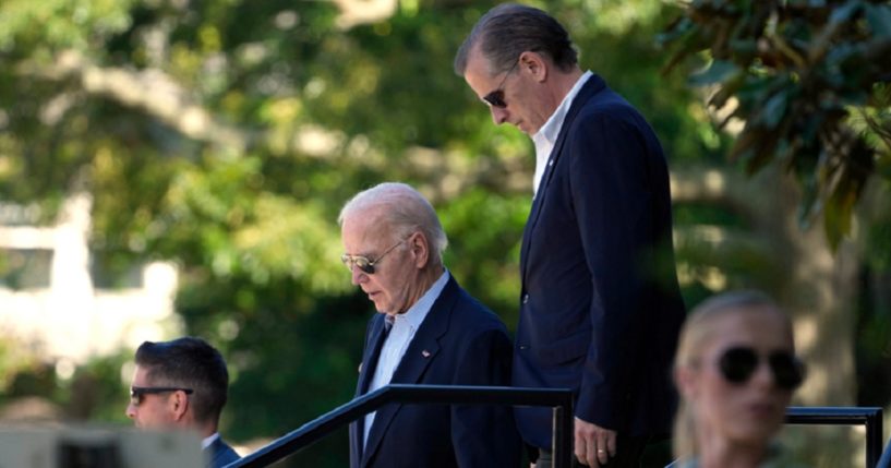 President Joe Biden , left, and Hunter Biden, right, are pictured leaving St. Edmond Catholic Church in Rehoboth Beach, Delaware, on Saturday.