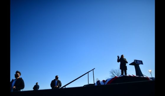 A trio of Secret Service agents monitor activity as Sen. Kamala Harris (D-CA) speaks at a drive-in rally on the eve of the general election on November 2, 2020 in Bethlehem, Pennsylvania.