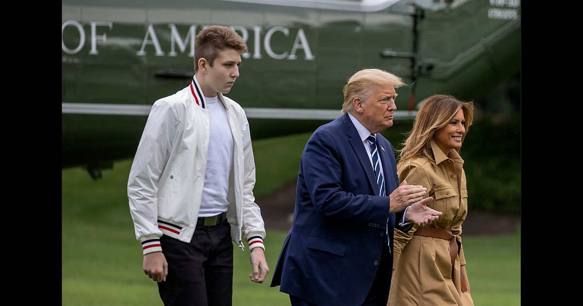 Barron Trump, US President Donald Trump and First lady Melania Trump walk on the South Lawn of the White House on August 16, 2020 in Washington, DC.